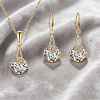 Ensemble collier et boucles d'oreilles géométriques tendance - Style goutte luxueux avec une touche haut de gamme et un attrait polyvalent
