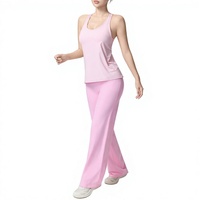 Ensemble de yoga respirant trois pièces en nylon et élasthanne avec débardeur en maille et pantalon taille haute à jambes larges, tenue de sport unie