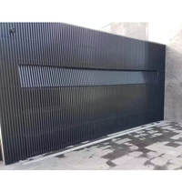 Porte de garage moderne isolée en aluminium noir électrique automatique intelligente pour villa de luxe