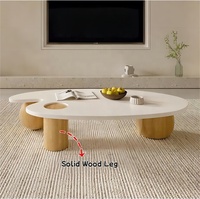 Table basse ovale en bois massif blanc nordique, finition brillante Wabi-Sabi, forme irrégulière, taille personnalisable, luxe avec trois pieds