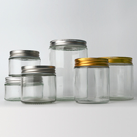 OEM personalizado 15ml 30ml 50ml 100mL tarro cosmético de vidrio transparente botellas de crema facial contenedor para el cuidado de la piel con tapón de rosca de aluminio