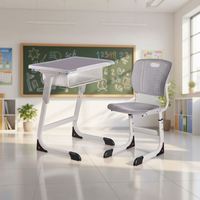 Ensemble bureau et chaise ergonomiques réglables en hauteur pour étudiants, avec dossier solide et structure métallique, idéal pour l'étude en classe