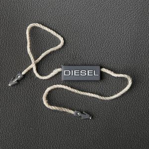 Giá thấp tùy chỉnh bạc lá dập nổi logo con dấu nhựa tag khóa cho hàng may mặc - Product Image 2