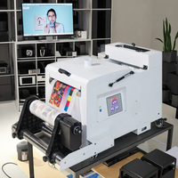 Nouvelle arrivée : Machine à poudre DTF A3 blanche avec enveloppeur à rouleaux et chauffage pour l'impression textile sur t-shirts