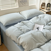 Ensemble de literie personnalisé OEM ODM en coton épais teint en masse à rayures, ensemble de literie 4 pièces uni, drap doux froissé bicolore pour la maison et l'hôtel