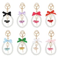 Boutons de manchette en métal style Ins avec nœud perlé, accessoire créatif fait main, porte-clés en cristal Fille de ballet pour toutes les saisons