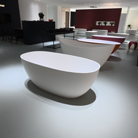 Baignoire autoportante ovale monobloc en surface solide pour hôtels de luxe, baignoire en pierre artificielle