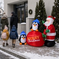 Décoration de jardin gonflable de Noël en forme de couple de pingouins, illuminée avec Père Noël et un sac cadeau, pour les fêtes en plein air et la décoration intérieure
