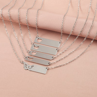 Collier couple tendance transfrontalier avec pendentif long en acier inoxydable, motif cœur ajouré et gravure laser miroir