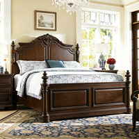 Cadre de lit en bois foncé de style classique européen avec des sculptures ornées pour chambre à coucher de luxe