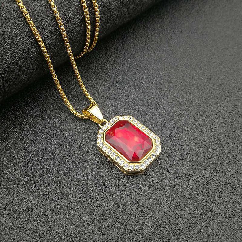 Colgante de oro con diamantes rojos