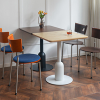 Table à manger ronde moderne Botai de style nordique, plateau en MDF, base en alliage d'acier, 4 places, résistante à l'eau, meubles pour la maison, café, salon de thé