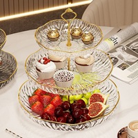 Présentoir à fruits rond à trois niveaux en plastique, style luxe léger, pour fruits secs et bonbons, idéal pour l'inauguration de la maison