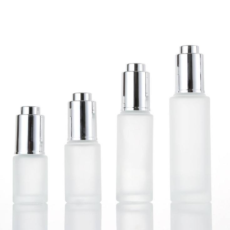 Frosted bottle with silver tops