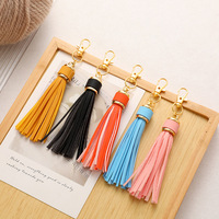 Porte-clés transfrontalier en cuir PU avec pompon, bracelet en silicone, accessoires à pompon, pendentif de sac, porte-clés en cuir