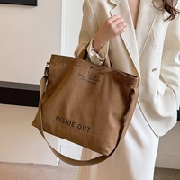 Sac à main élégant et moderne en toile pour femme, sac à bandoulière pour trajets quotidiens, grande capacité, sac d'école décontracté vintage avec bouton à lettres