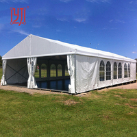 Tente de réception 10x40m économique, résistante au vent, avec podium pour mariages et événements
