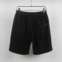 Shorts texturés noirs pour hommes, taille élastique, cordon de serrage, poche latérale fendue, poche arrière, coupe décontractée, longueur mi-longue, shorts décontractés