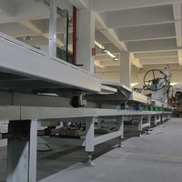 Système d'assemblage robotisé automatique pour panneaux de porte automobiles de type anneau sur chaîne de production