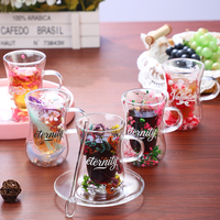 Vente en gros de tasses à café en verre à double paroi isolées, transparentes, résistantes à la chaleur, en borosilicate de haute qualité, avec fleurs séchées