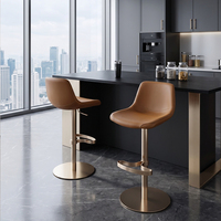 Chaise de bar de luxe pour îlot de cuisine, avec assise rembourrée douce, piétement en métal champagne brillant, repose-pieds et réglage de la hauteur