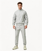 Ensemble de survêtement en nylon basique sur mesure OEM pour hommes, coupe classique, avec broderie de logo, poignets élastiqués imperméables, survêtement deux pièces