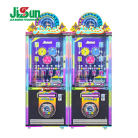 Machine de jeu à pince à prix avec armoire noire, thème horloge, piliers LED arc-en-ciel et prix porte-clés pour salle de bowling