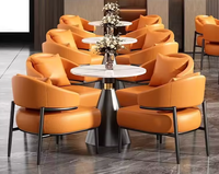 Ensemble de meubles de luxe moderne, fauteuil lounge en cuir PU orange, table ronde en pierre frittée, mobilier commercial pour hôtel