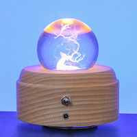Base de boîte à musique rotative en bois circulaire minimaliste moderne avec cristal lumineux, couleur et taille personnalisables