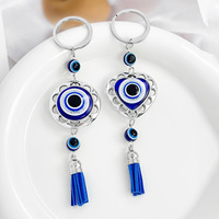Porte-clés en alliage œil turc incrusté de strass faits à la main, breloque de sac œil turc bleu étincelant avec pompon pour la décoration de sac à main
