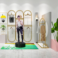 Vente en gros Étagère de magasin de vêtements moderne Dernier modèle Étagère de présentation de vêtements Étagère pour chaussures et sacs Présentoir de vêtements pour enfants