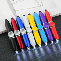 Stylo multifonctionnel 3-en-1 avec fidget spinner, lumière LED pour écrans tactiles, soulagement du stress et écriture nocturne