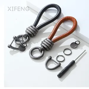 سلسلة مفاتيح من الجلد XIFENG مصنوعة من المورد بشعار مخصص سلسلة مفاتيح جلدية فاخرة للسيارة سلسلة مفاتيح منظم حقيقي من جلد PU
