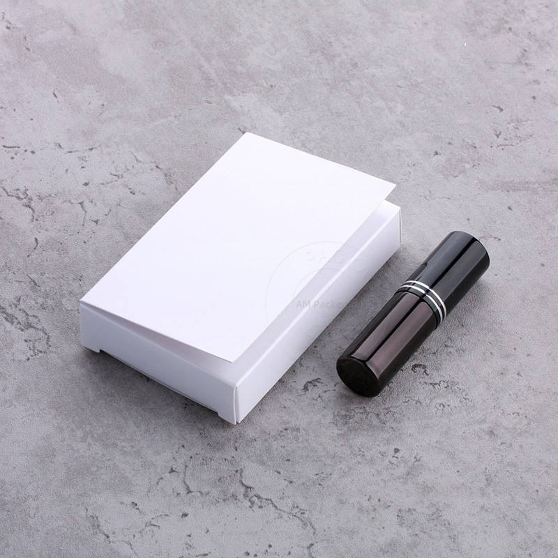 Black perfume spray bottle with white box