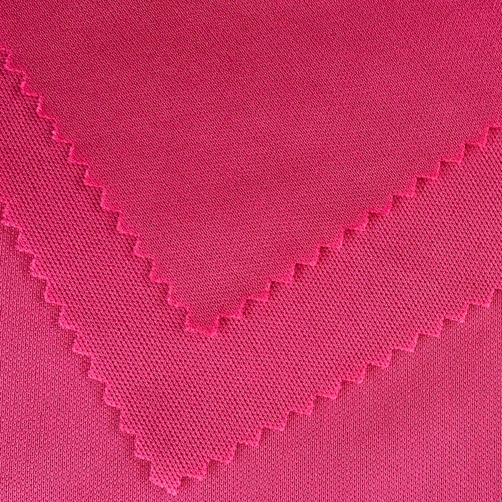 Vente en gros de tissus tricotés unis en polyester extensible dans les 4 sens Tissu tricoté Interlock P/D Tissu pour pantalons et t-shirts