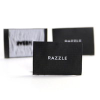 Étiquettes tissées personnalisées en sergé noir avec motif côtelé distinctif pour couverture textile de maison