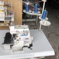 Machine à coudre surjeteuse Juki6704S d'occasion, super haute vitesse, 4 fils