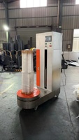Machine d'emballage automatique de bagages à film étirable pour aéroports, idéale pour valises de voyage et la logistique aéroportuaire
