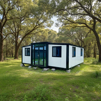 Maison conteneur modulaire préfabriquée en acier de 30 pieds avec façade en verre étanche, conception extensible à double aile pour habitation Ray-Zen