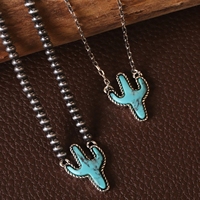 Collier chaîne en alliage avec pendentif croix estampée, style vintage western 2026, orné de pierres turquoise, de perles Navajo et d'un motif chapeau de cowboy