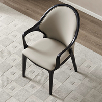 Fauteuil de salle à manger moderne BST en bois noir avec dossier ovale et revêtement en cuir crème pour salle à manger et cuisine