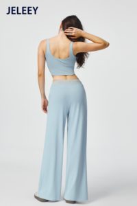 Matching set featuring a sports vest and loose-fitting, straight-leg <b>trousers</b> with an adjustable <b>drawstring</b>. - Product Image 5