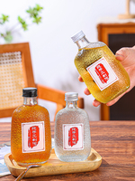 Bouteilles en verre sérigraphiées pour jus, fruits, vin et boissons avec bouchon rotatif en aluminium et design estampé or (100/200/300ml)