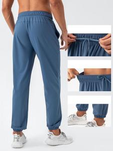 Pantalon de jogging uni fin pour homme avec cordon de serrage, coupe ample et poches latérales, idéal pour le fitness et la course à pied - Product Image 2