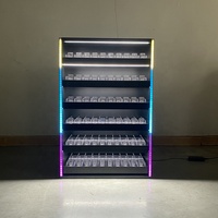 Vitrine métallique moderne APEX avec éclairage LED, boîtier en acrylique et plusieurs rangées de présentoirs en acrylique transparent pour magasin de tabac