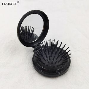 กระจกพกพาแบบพับได้ OEM รุ่นมินิ ทรงกลม ทำจากพลาสติก พร้อมหวีแปรงผมแบบลม - Product Image 1