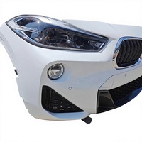 Kit de carrocería de segunda mano para BMW X2 F39: Parachoques delantero, labio de parachoques, faros y kit de reparación de parachoques.