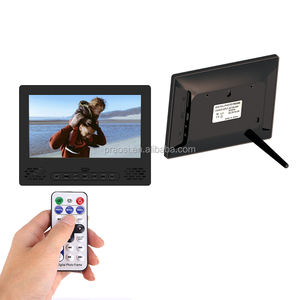 Cadre photo numérique <span class=keywords><strong>de</strong></span> 7 pouces avec nouveau design boutons <span class=keywords><strong>avant</strong></span> té<span class=keywords><strong>l</strong></span>écommande lecture vidéo MP4/AVI Audio MP3 caractéristiques fonction d'horloge - Product Image 1
