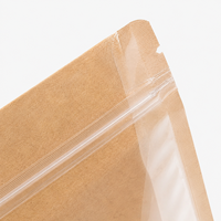 Sac en papier kraft brun en stock, pochette debout avec fermeture éclair sur le dessus et face avant transparente pour l'emballage des noix, des céréales et des fruits secs