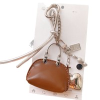 Sac à accessoires de créateur à suspendre, mini sac moderne en cuir PU, breloque de sac, petit sac coquille exquis de haute qualité, porte-clés de sac de luxe
